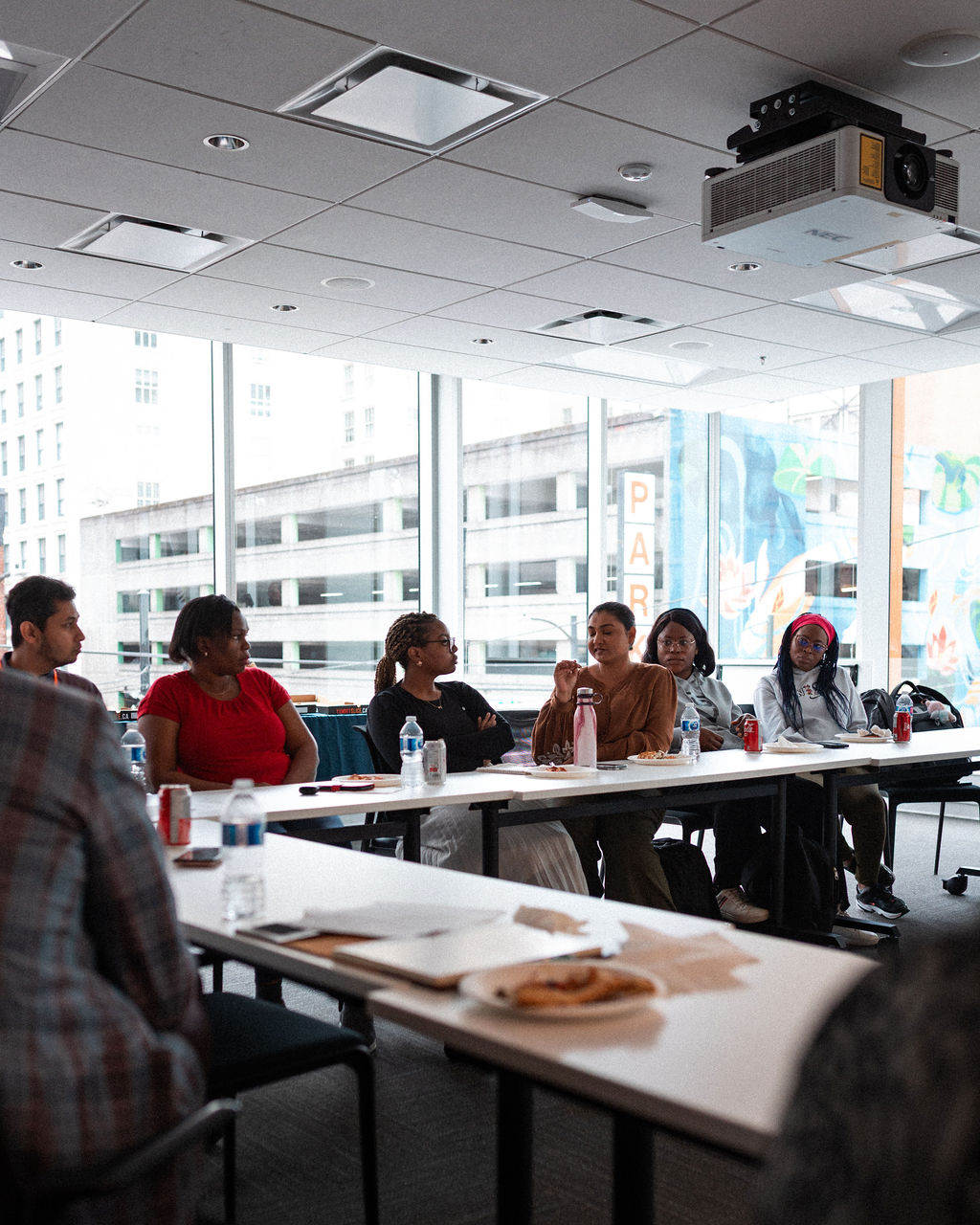 Adler University leaders convene in the boardroom at the Vancouver campus.