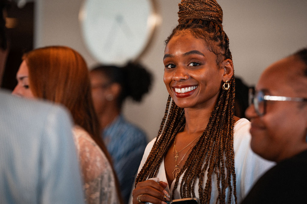 An Adler University community member smiles.
