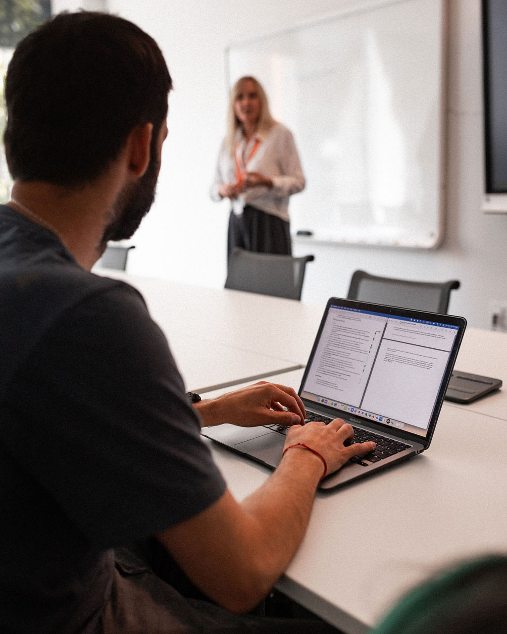 An Adler University Student takes notes at a lecture at Adler's Vancouver Campus.