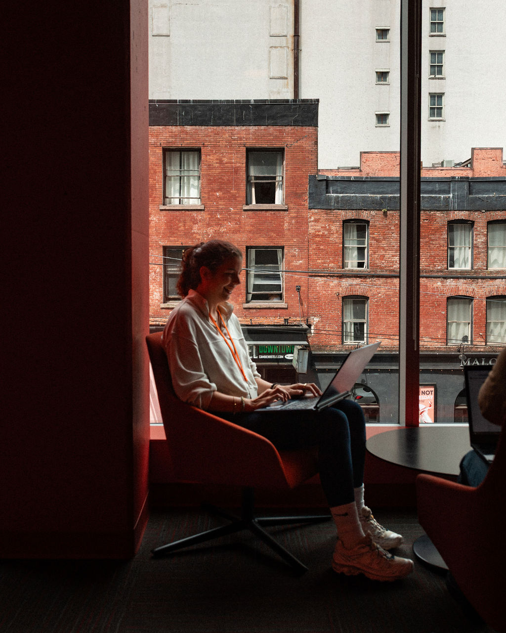 A student at Adler University's Vancouver campus studies in the common area.