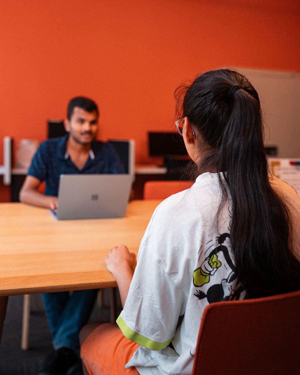 Adler students study together in the library.