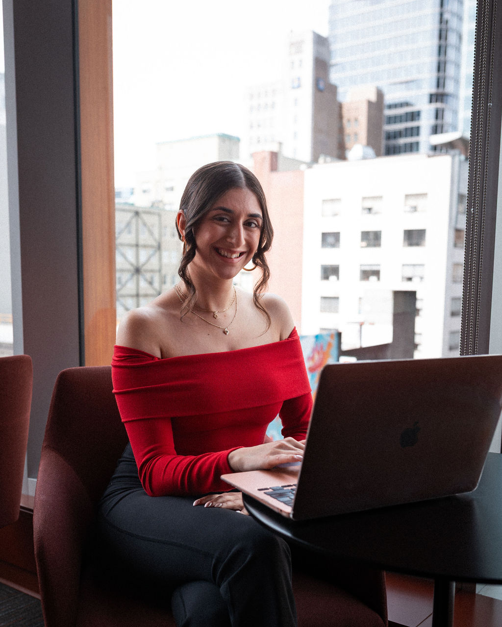 A psychology student works on her laptop at Adler University's Vancouver Campus.