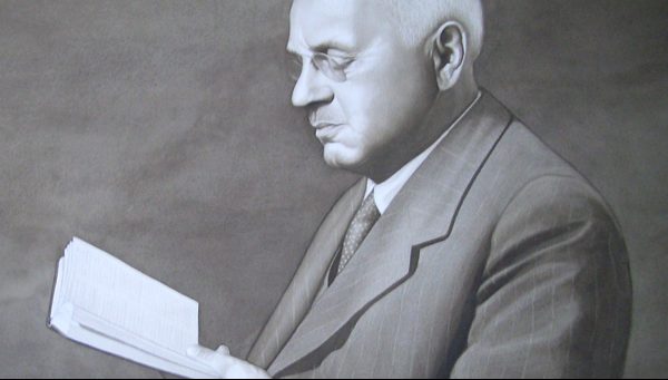 A portrait of Alfred Adler, the namesake of Adler University.